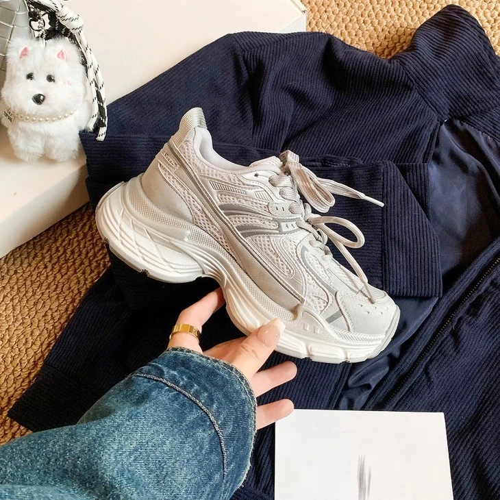 product-1-1 Grey chunky platform sneaker close up held in hand