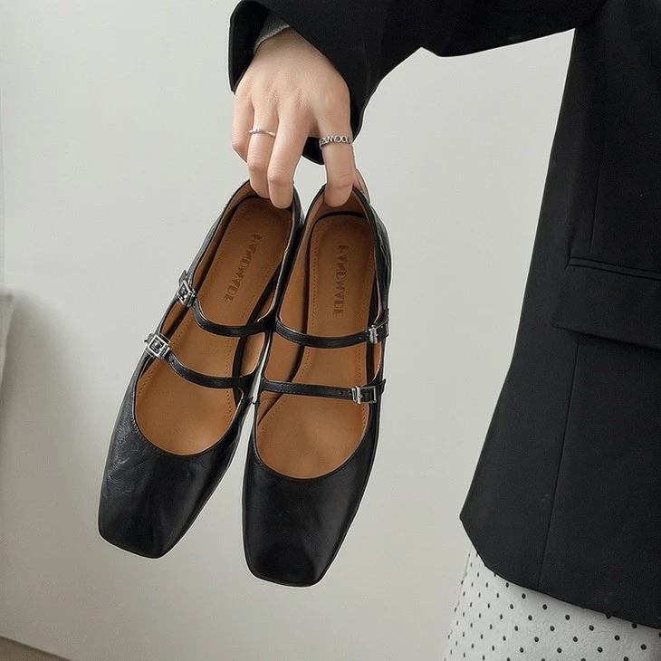 product-1-1 Black double strap Mary Jane flats held in hand
