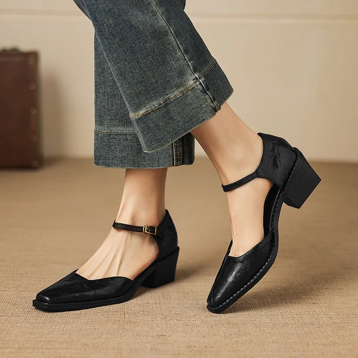 Black cut out Mary Jane block heel shoes on foot