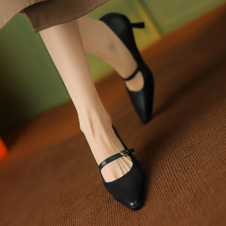 product-1-1 Black pointed toe Mary Jane stiletto heels worn with a midi skirt